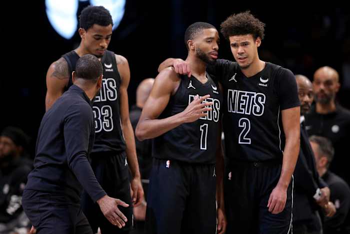 Brooklyn Nets forward Mikal Bridges (1) talks to forward Cameron Johnson (2) during the fourth quarter against the Portland Trail Blazers